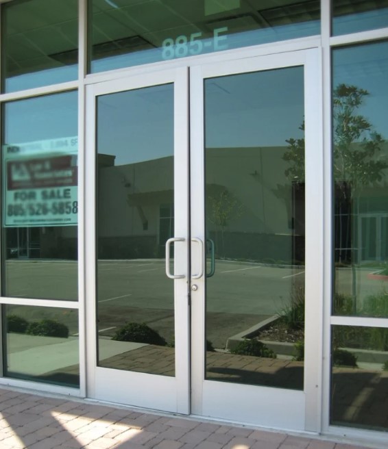 Store Front Windows & Entrance – 10 mm Tempered Glass Commercial Storefront System, Frameless/Framed Shopfront Windows and Glass Doors by INFOCUS Glass & Aluminium Works, Dubai